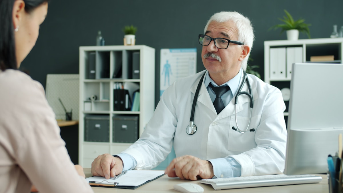 Doctor consulting with patient in modern clinic